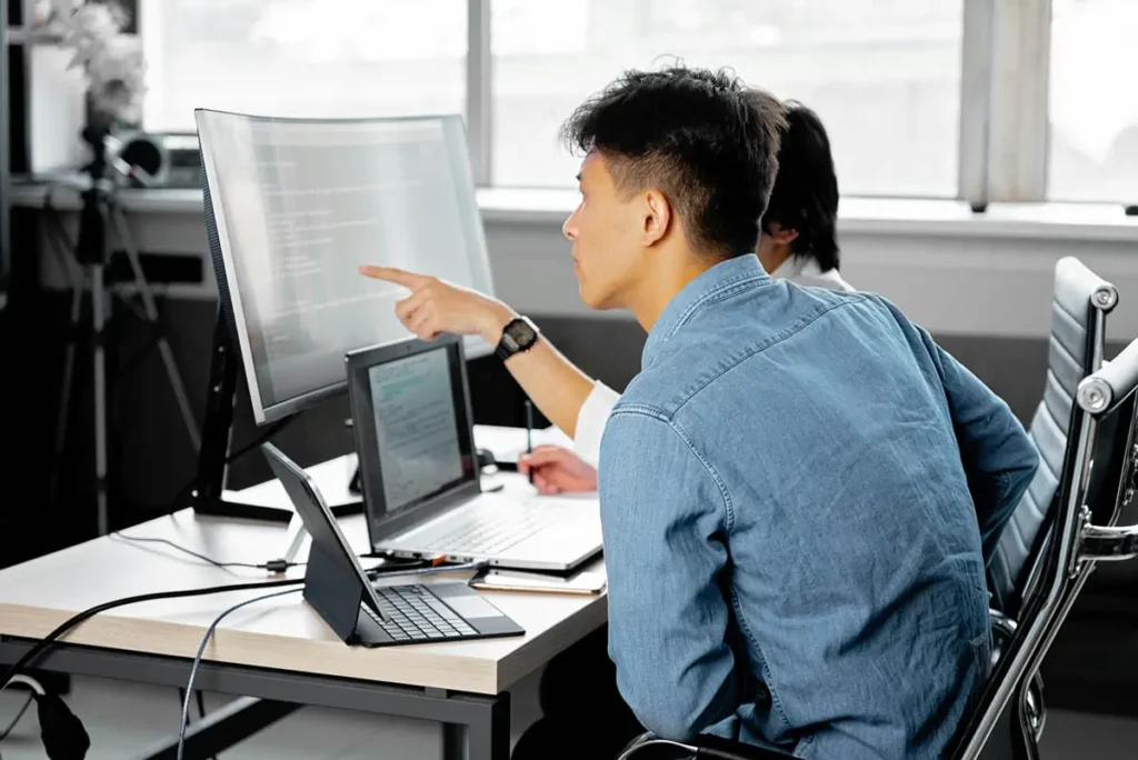 men infront computer