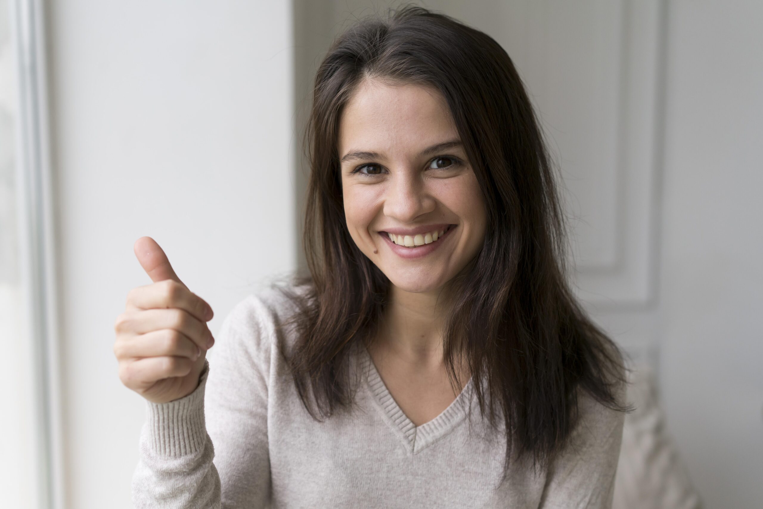 woman showing ok sign scaled